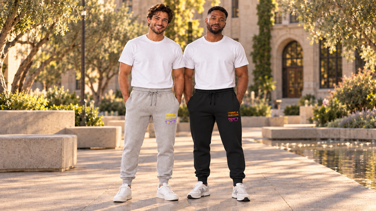 Two men wearing Heather Grey and Black Clan of Nerds joggers in a campus garden